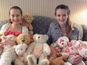 Teresa McDonald and Caitlin Donahoe collected dozens of teddy bears for patients at the Mass Hospital School and will be honored at the JFK Library.
