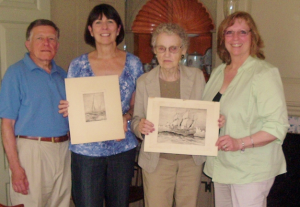 Photo of Steve O’Donnell, Linda Pirie, Suzanne Sarr and Linda Bresnahan-McCarthy holding 2 of the etchings being donated to the Milton Historical Society.