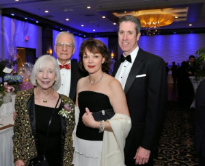 Anne K. Collins of Milton and Linda Healy, behind them are Webster Collins and Peter Healy, President and CEO of BID-Milton