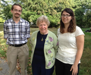 Dr. Catherine B. Shannon, center, on the grounds of Forbes House Museum with Curry College interns, Megan Birden and Julian Weiss