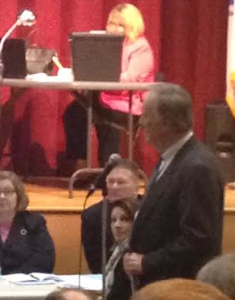 Moderator Walsh in his capacity as a ex officio Town Meeting Member addressing the . . . Moderator - photo by Deborah Milbauer