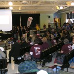 School Committee member Becky Padera (in yellow top) addresses the crowd