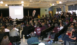 School Committee member Becky Padera (in yellow top) addresses the crowd