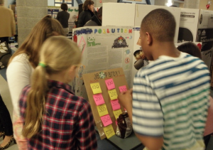 Pierce students play "Jeopardy" as part of a science fair exhibit on pollution.