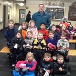 Coach Paul Cox with his class of young skaters.