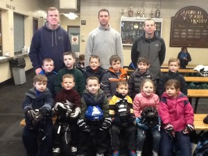 Dave Finn, Christian Leimkuehler, and Kevin Doyle with a group of budding young skaters.