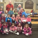 Don Greene and Mary Claire Cantor with their group of cute skaters.