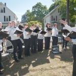 The Quincy Choral Society performed several pieces throughout the Crane Field Dedication Ceremony.