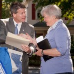 Master of Ceremonies Kathleen O'Donnell, on behalf of the Friends of Crane Field, accepts a citation from Representative Walter Timilty.