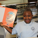 Marc Romain, shows off his Thanksgiving placemat